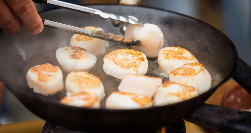 scallops cooked in a pan.