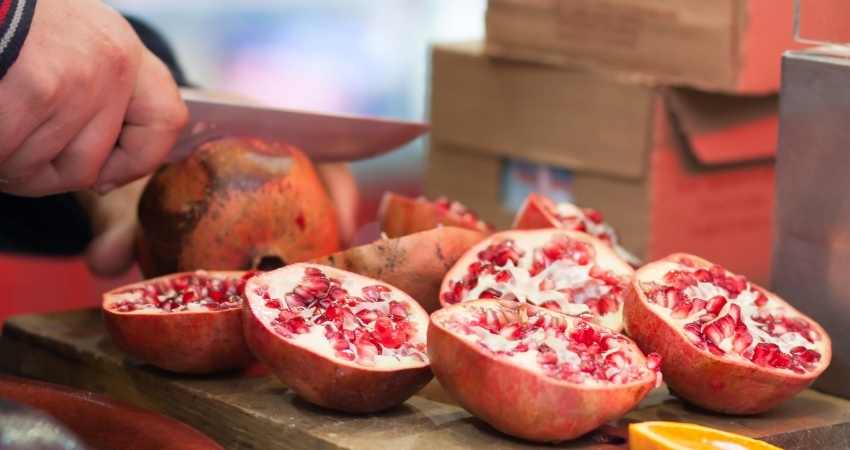 pomegranates cut in half on the counter.