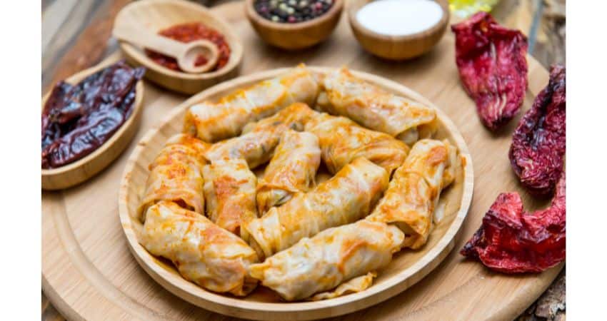 Cabbage rolls with side dishes.