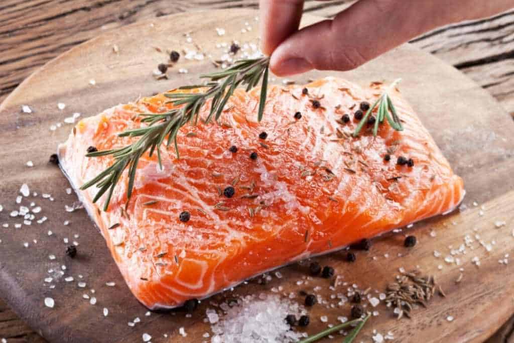 A fresh raw salmon fillet on a cutting board