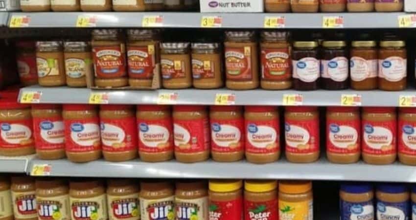Checking cashew and peanut butter in Walmart.