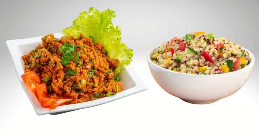 Cooked bulgur and cooked quinoa in bowls