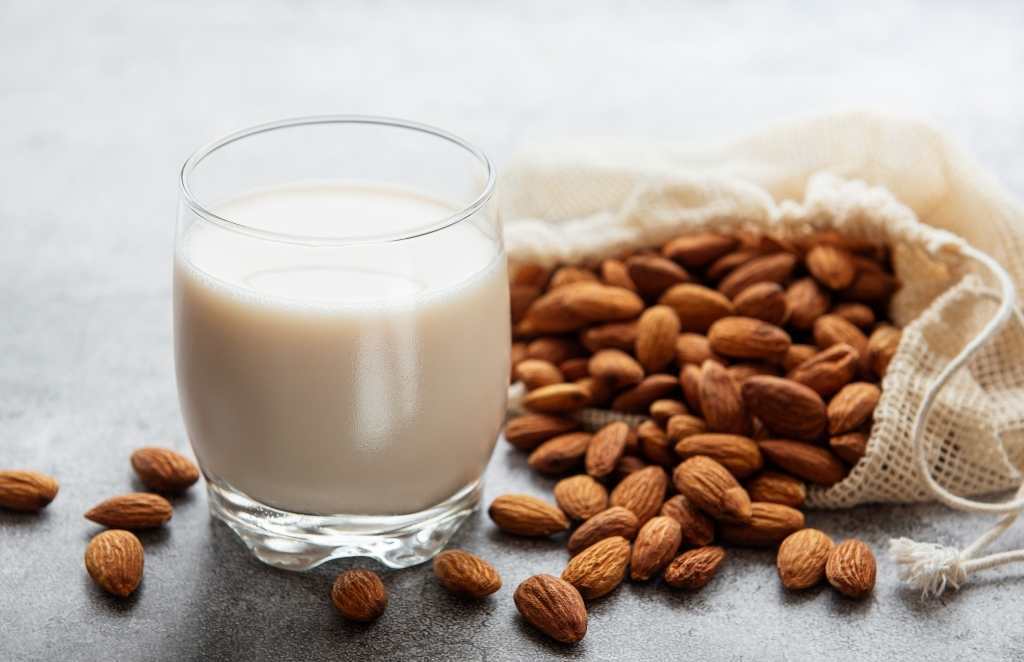 almonds and a glass of almond milk