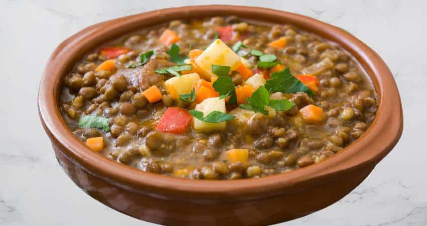 Cooked lentils with vegetables in a bowl