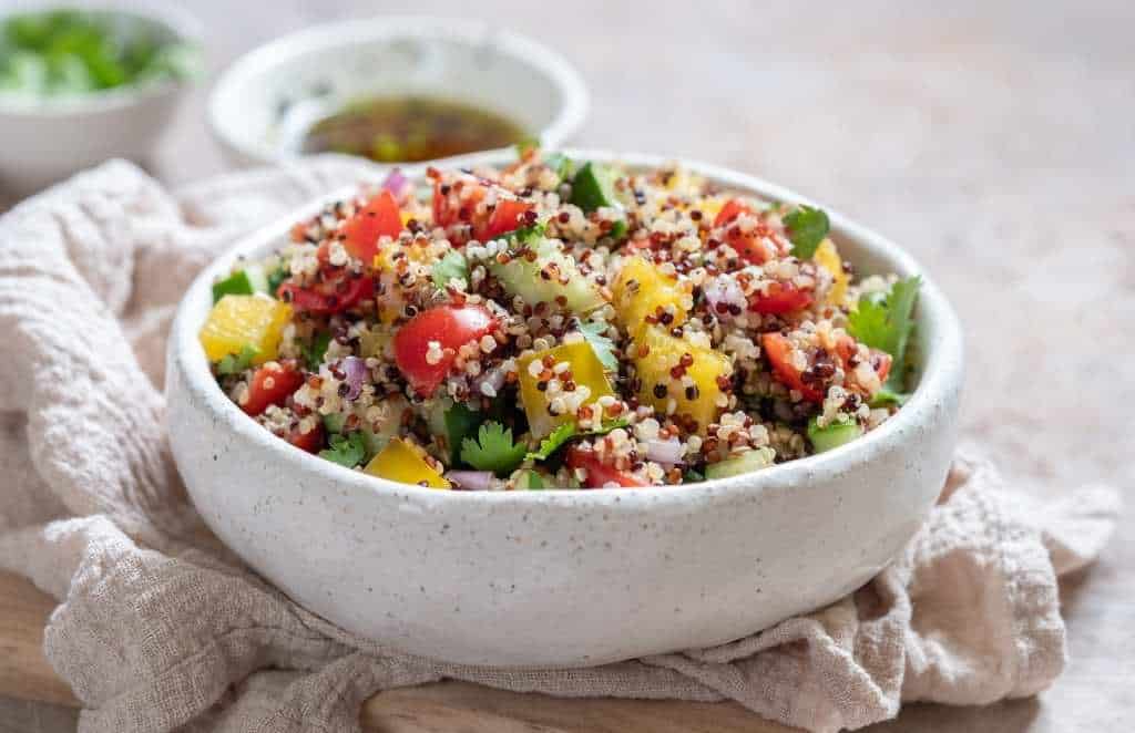 white quinoa and black quinoa in a salad