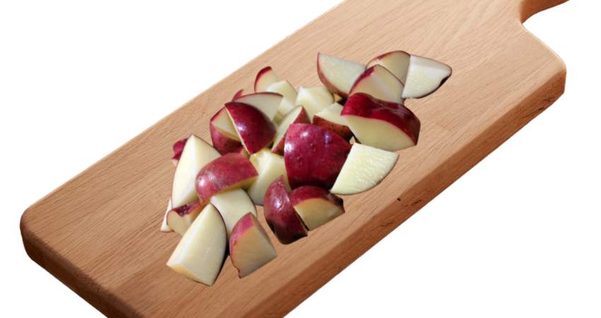 Red potatoes on a cutting board