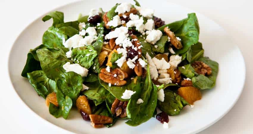 Spinach salad with walnuts and oranges.