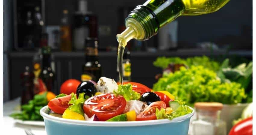 Extra virgin olive oil on a salad.