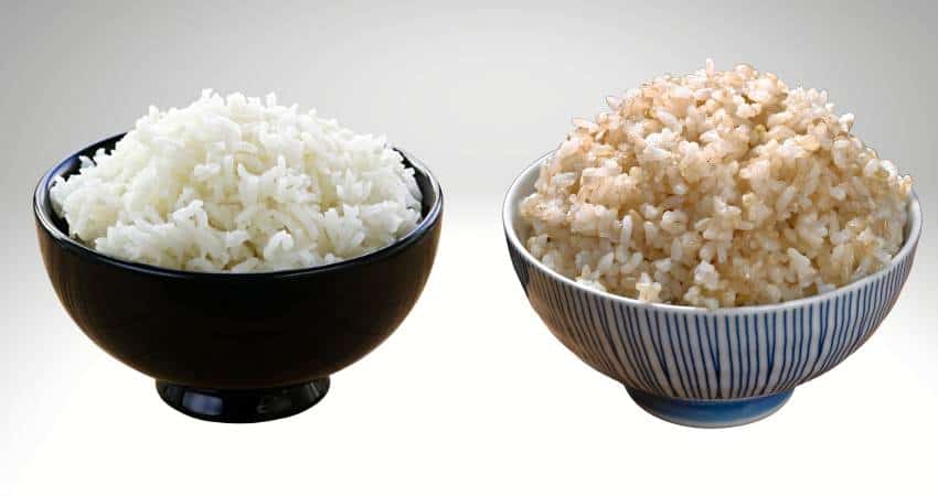 Cooked white rice and cooked brown rice in bowls