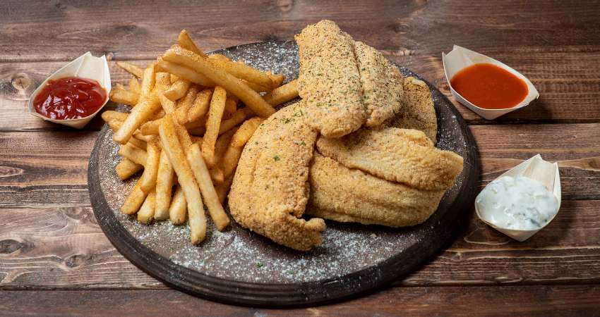 Catfish dinner with fries.