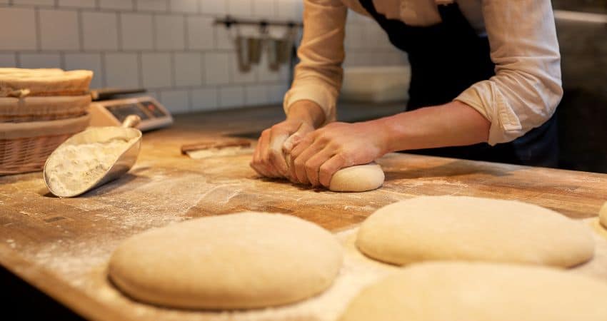 Preparing bread dough.