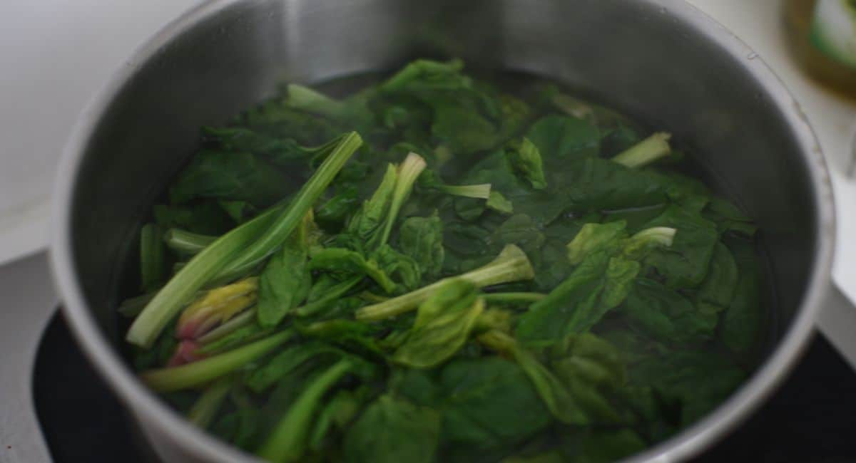 Blanching spinach.