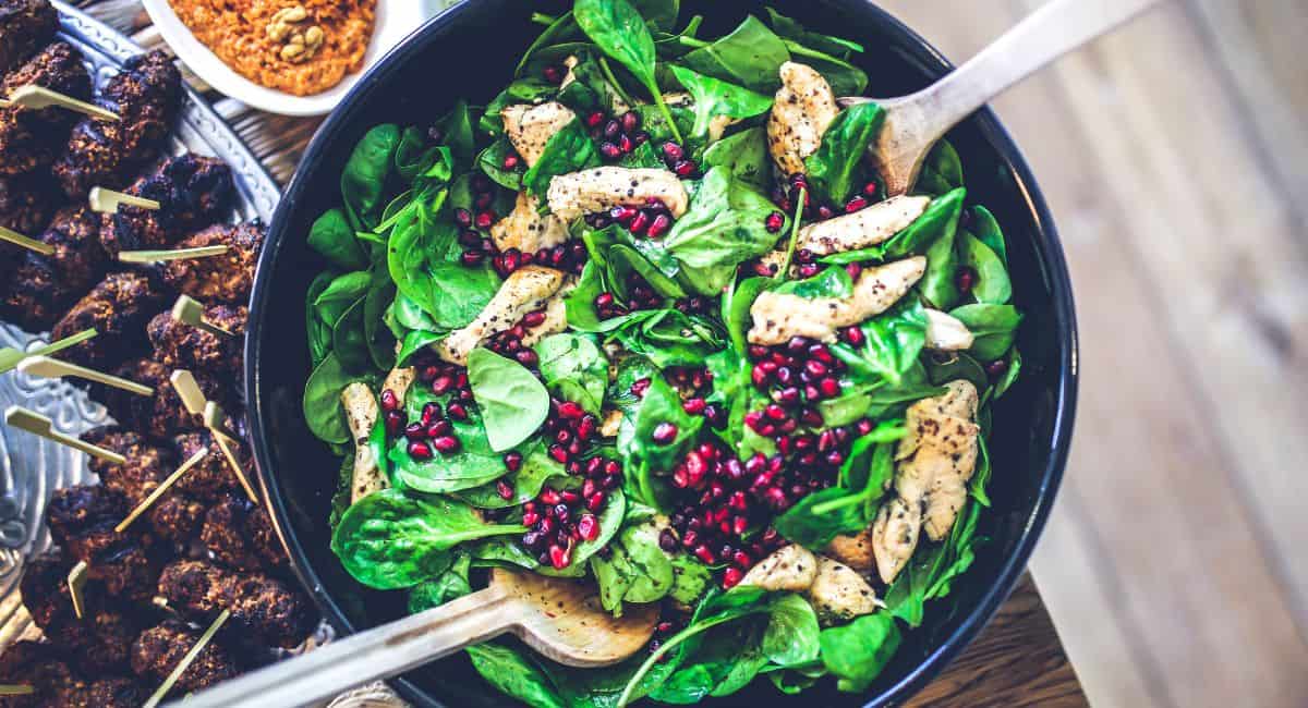 Spinach Salad With Pomegranate in a Bowl.