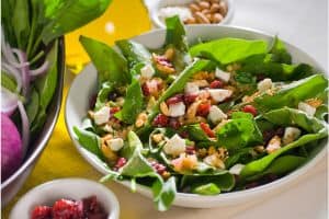 Spinach salad with nuts, cheese and berries.